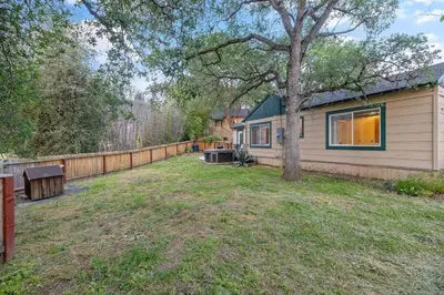 a yard with a house and a fence at 3B Hot Tub, 4mi from Sequoia, Arcade Games, Foosball in Three Rivers