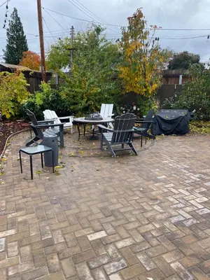 a group of chairs and tables on a patio at English Rose Garden Cottage near Roseville, CA in Citrus Heights