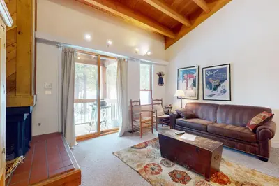 a living room with a couch and a table at Getaway at Gold Bend in Ponderosa Fairway Estates