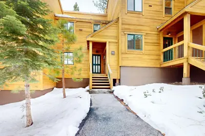 a wooden house with snow in front of it at Getaway at Gold Bend in Ponderosa Fairway Estates