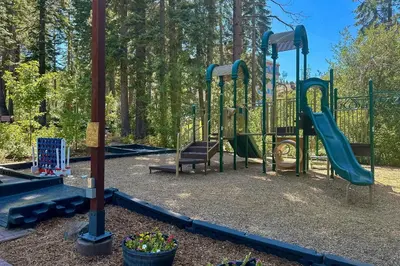 a playground with a slide in a park at Northstar Retreat in Kingswood Estates