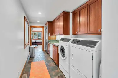 a laundry room with a washer and dryer at Stunning Mountain Gem with Hot Tub Near Palisades in Olympic Valley