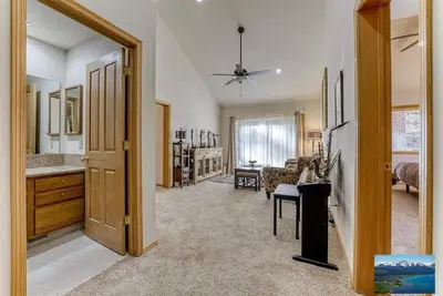 a living room with a kitchen and a dining room at 6000 sqft Pine House with indoor swimming pool in Reno