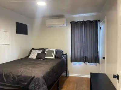 a bedroom with a bed and a window at A Little Bit Of Country in Visalia