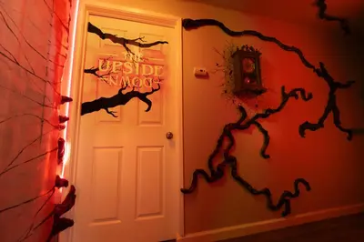 a halloween room with a door with a bat design at Immersive Stranger Things Experience in Clovis