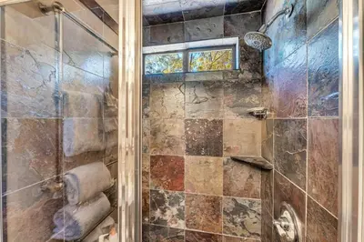 a bathroom with a shower with a glass door at 3-Level Incline Village Retreat with Fireplace in Incline Village