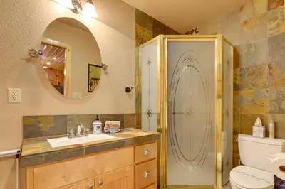 a bathroom with a shower and a sink and a toilet at 5 Mi to Dodge Ridge Cabin in Strawberry in Strawberry