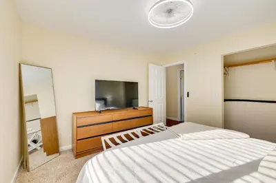 a bedroom with a bed and a flat screen tv at Fire Pit and Grill Retreat Between Arnold and Murphys in Hathaway Pines