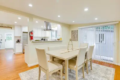 a kitchen and dining room with a table and chairs at Fire Pit and Grill Retreat Between Arnold and Murphys in Hathaway Pines