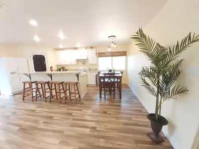 a kitchen and dining room with a potted plant in a room at Cody's Cozy Cottage-Near Yosemite in Mariposa