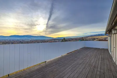 a balcony with a white wall and a wooden floor at Spacious Cozy and Furnished Bedroom Private Bathroom, Close to Everything in Reno