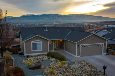 a house with a mountain in the background at Spacious Cozy and Furnished Bedroom Private Bathroom, Close to Everything in Reno