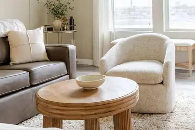 a living room with a couch and a coffee table at Amazing Water View with Jacuzzi & Sky Lounge in Sparks