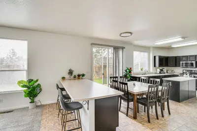 an open kitchen and dining room with a table and chairs at Family Reno Home with Game Room! 28 Mi to Ski Resort in Reno