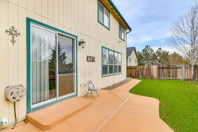 a chair sitting on a patio next to a house at Family Reno Home with Game Room! 28 Mi to Ski Resort in Reno