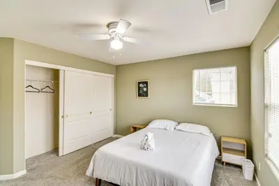 a bedroom with a bed and a ceiling fan at Family Reno Home with Game Room! 28 Mi to Ski Resort in Reno