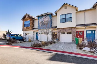 a house with a car parked in front of it at 4 Mi to Dtwn Family-Friendly Townhome in Reno in Reno