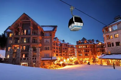 a gondola is flying over a city with buildings at Timber Creek 309 condo in Truckee