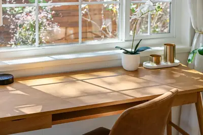 a wooden table in a kitchen with a window at Cozy Reno Midtown Retreat Fire Pit & Parking in Reno