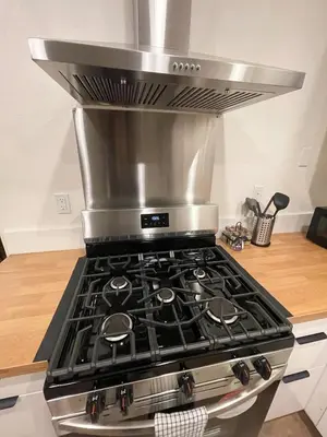 a stove top oven sitting in a kitchen at 4 bedroom Home in Tracy 2 Minutes to Highway in Tracy