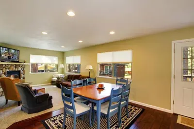 a living room with a wooden table and chairs at Ormsby House 1489O in South Lake Tahoe