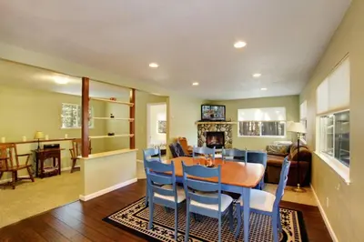a dining room and living room with a table and chairs at Ormsby House 1489O in South Lake Tahoe