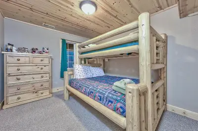 a bedroom with a bunk bed and a dresser at 1965NP The Bears Den in South Lake Tahoe