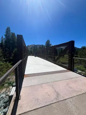 a bridge with a person riding a bike on it at Cholula Chalet 811C in South Lake Tahoe