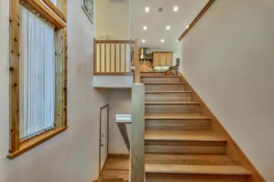 a staircase in a house with wooden floors and a window at Das Waldhaus 1973P in South Lake Tahoe