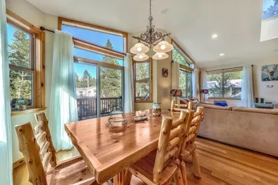a dining room with a wooden table and chairs at Das Waldhaus 1973P in South Lake Tahoe