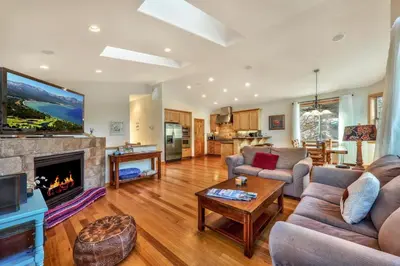 a living room with a couch and a fireplace at Das Waldhaus 1973P in South Lake Tahoe