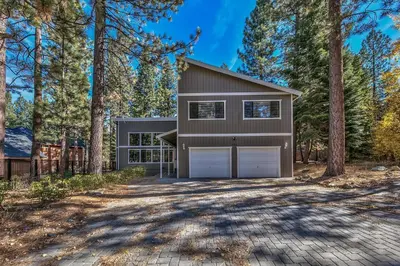 a house with a garage in the woods at 121M The Meadow Drive in Stateline