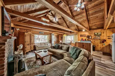 a living room with a couch and a table at Hank Monk Chalet 2730HM in South Lake Tahoe