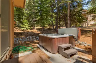 a bath tub sitting outside of a house at The Westlands Lodge 1135AC in South Lake Tahoe