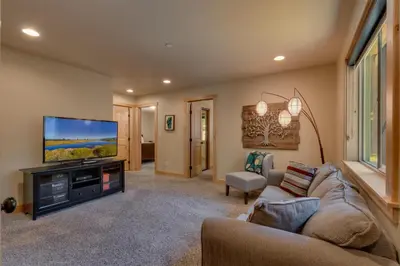 a living room with a couch and a flat screen tv at The Westlands Lodge 1135AC in South Lake Tahoe