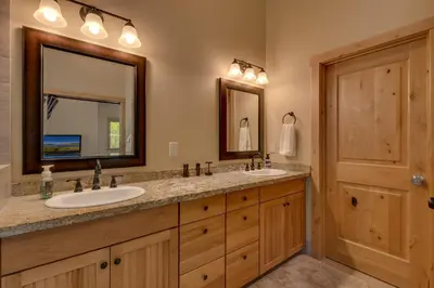 a bathroom with two sinks and a large mirror at The Westlands Lodge 1135AC in South Lake Tahoe