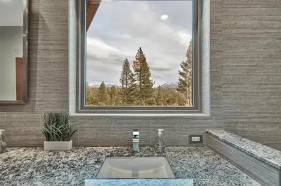 a bathroom with a sink and a large window at 1044C Coyote Ridge in South Lake Tahoe