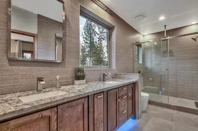 a bathroom with two sinks and a shower at 1044C Coyote Ridge in South Lake Tahoe