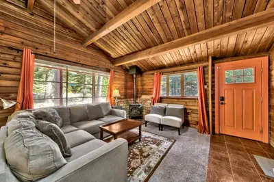 a living room with a couch and a red door at 1577A The Tahoe Lazy Bear in South Lake Tahoe