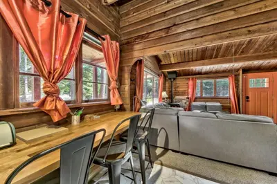a dining room with a bed and a table and chairs at 1577A The Tahoe Lazy Bear in South Lake Tahoe