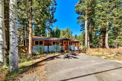 a house in the middle of a forest at 1577A The Tahoe Lazy Bear in South Lake Tahoe