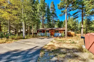 a house in the middle of a forest at 1577A The Tahoe Lazy Bear in South Lake Tahoe