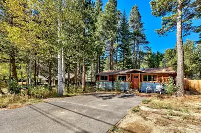 a house in the middle of a forest at 1577A The Tahoe Lazy Bear in South Lake Tahoe