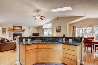 a kitchen with a large island in a living room at 1144GB The Golden Bear Retreat in South Lake Tahoe