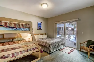 a bedroom with two bunk beds and a window at 1144GB The Golden Bear Retreat in South Lake Tahoe