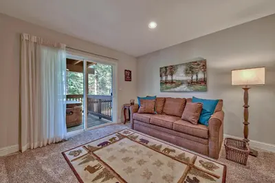 a living room with a couch and a window at 122G Where Eagles Fly in South Lake Tahoe