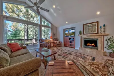 a living room with a couch and a fireplace at 122G Where Eagles Fly in South Lake Tahoe