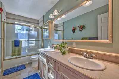 a bathroom with a sink and a toilet and a mirror at 122G Where Eagles Fly in South Lake Tahoe