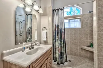 a bathroom with a sink and a shower at Tall Pines in South Lake Tahoe