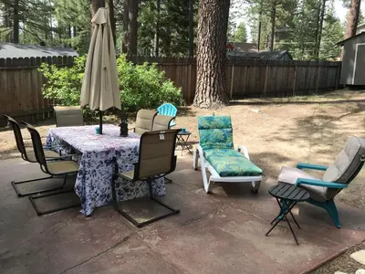 a patio with a table and chairs and an umbrella at Peace of Heaven 2566C in South Lake Tahoe